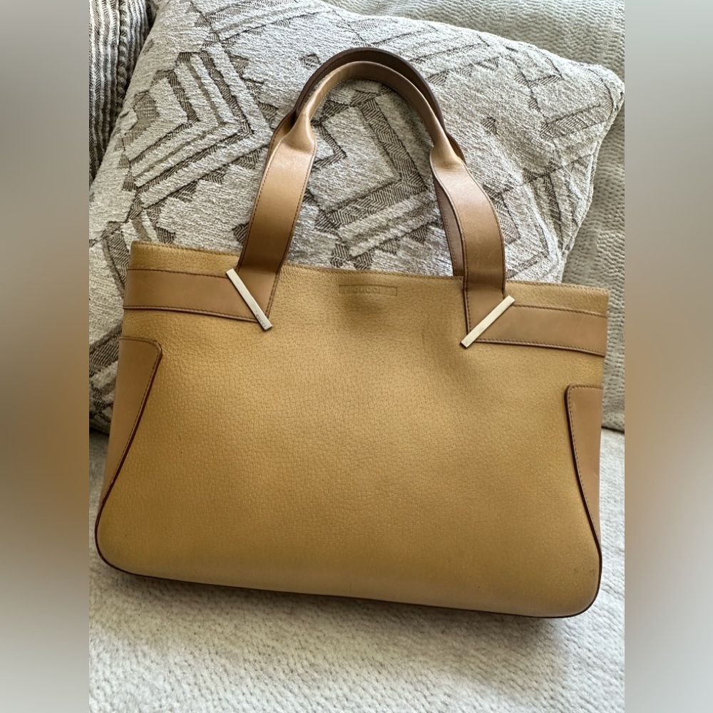 Authentic Gucci leather tote bag with handles.